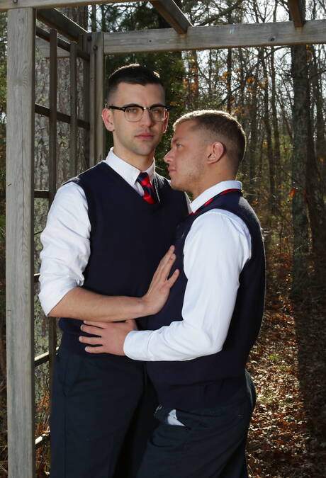 Young Ian Levine in glasses kissing with mature beard gays