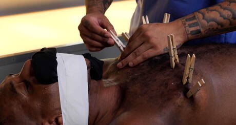 Beefy Jon Darra and ebony stud Micah Martinez in bdsm porn scene