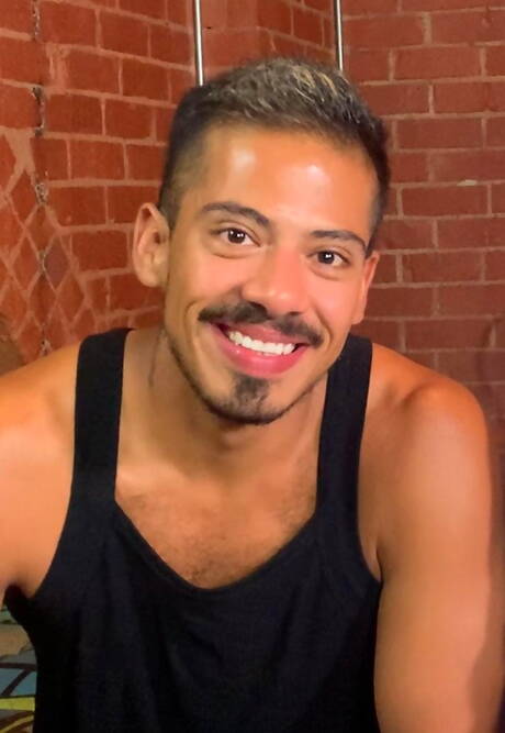 Ebony strongman August Alexander and stud Santino Cruz in bondage sex scene