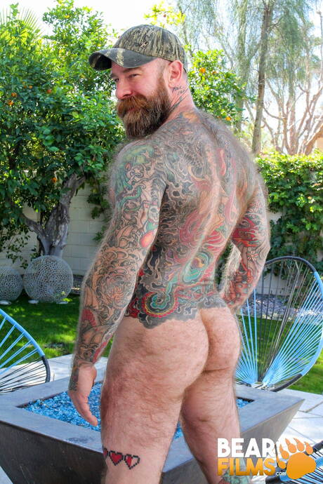 American gay bear Jack Dixon undressing and showing nice butt outside