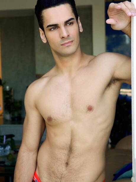 Latino bull Ivan Troy teasing his cock at pool